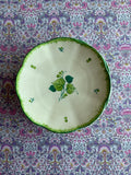 Four green hand painted plates