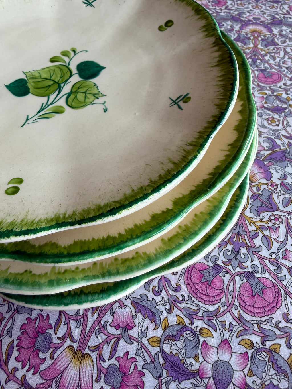 Four green hand painted plates