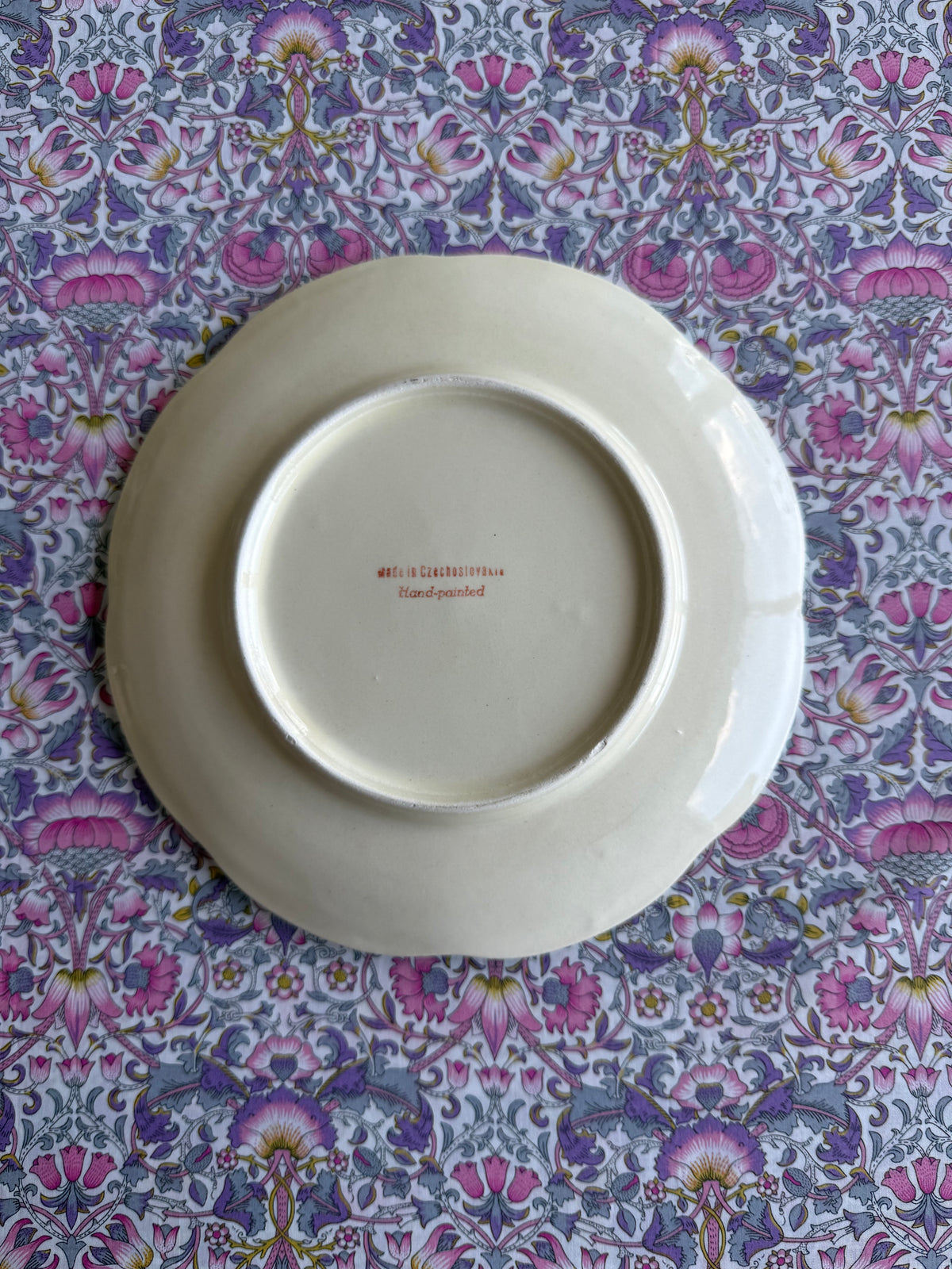 Four green hand painted plates